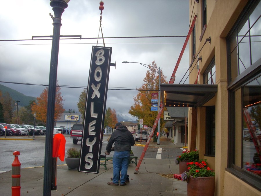 The real sign goes up...